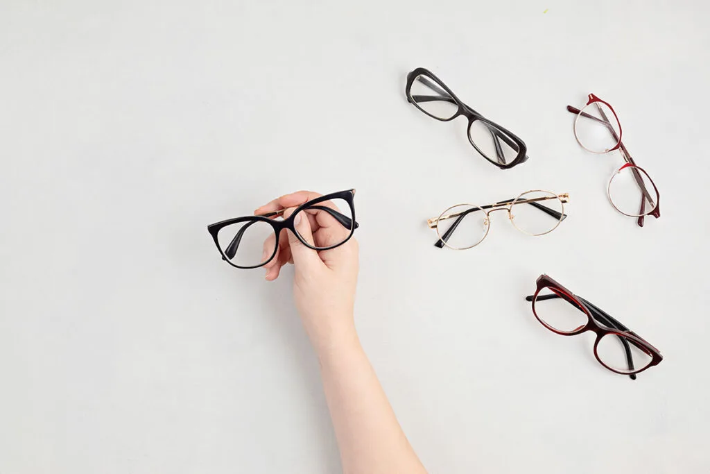 woman-hand-holding-eyeglasses-optical-store-glas-2021-09-03-21-11-08-utc-copy.jpg